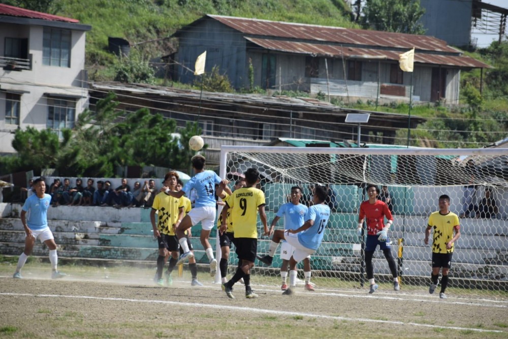 Players of Peren (blue) and Longleng (yellow) in action during the third match on Monday.